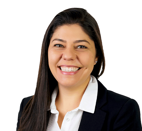 Smiling woman with long dark hair wearing a white shirt and black blazer